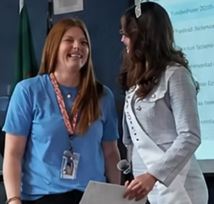 Ashley Loncon smiling alongside Lilac Princess Chloe Nelson